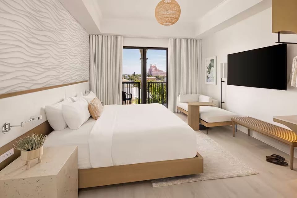 Wake up to breezy balcony views from this spacious, elegant room.