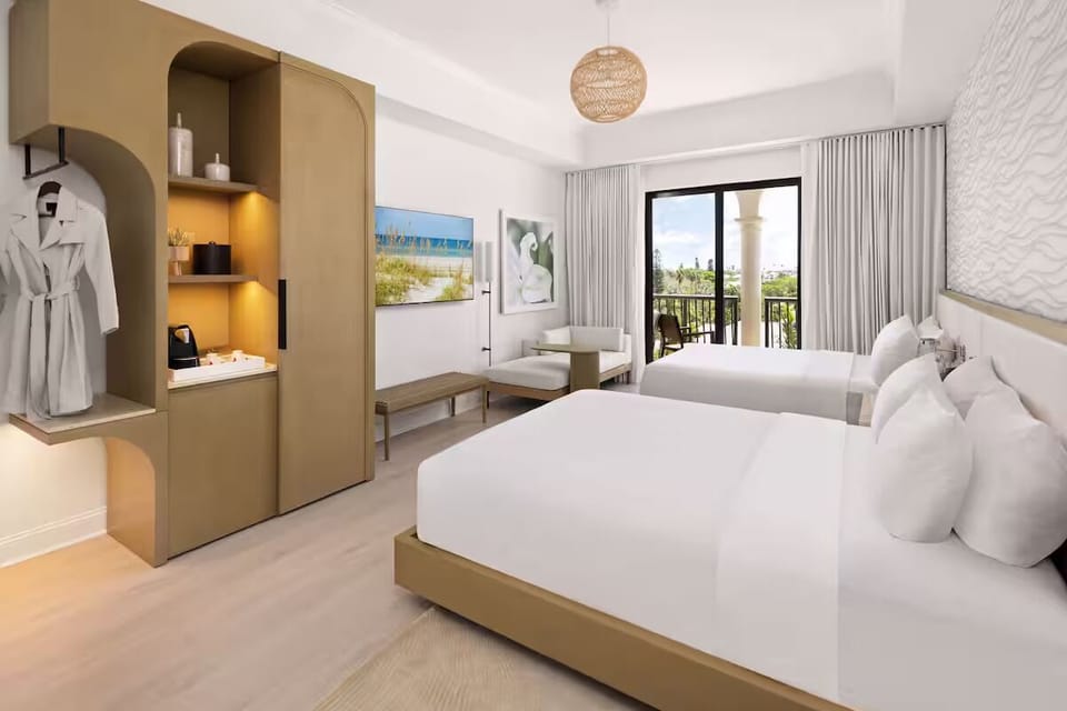 Unwind in crisp linens with smart storage and serene light.
