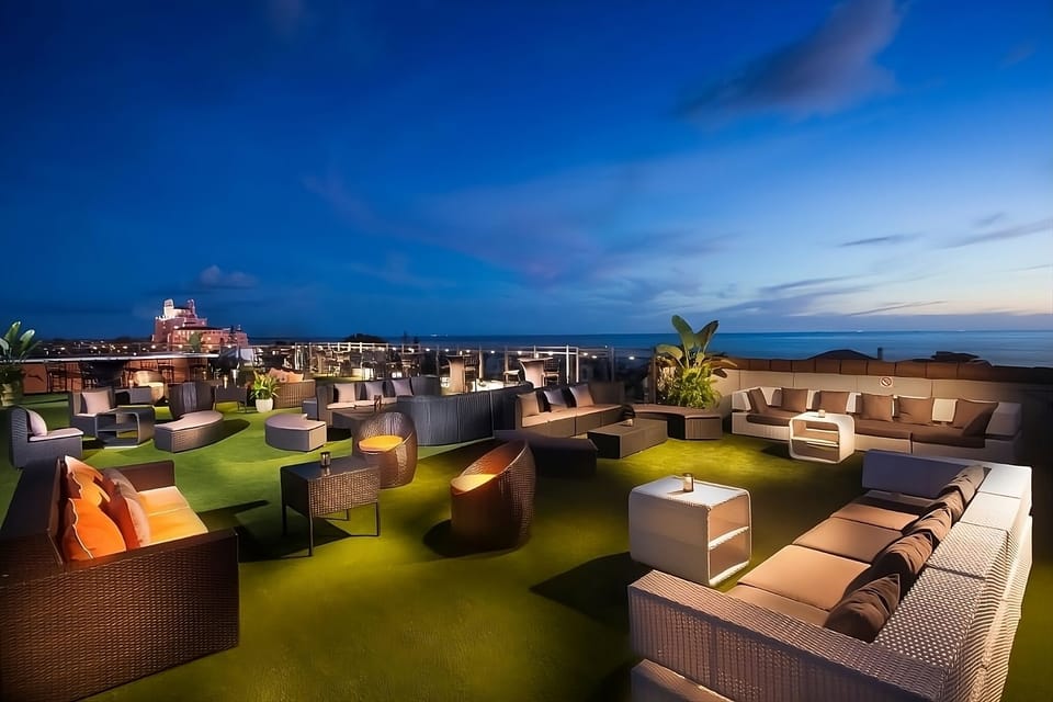 Gather on the rooftop and watch the sky melt into sea.