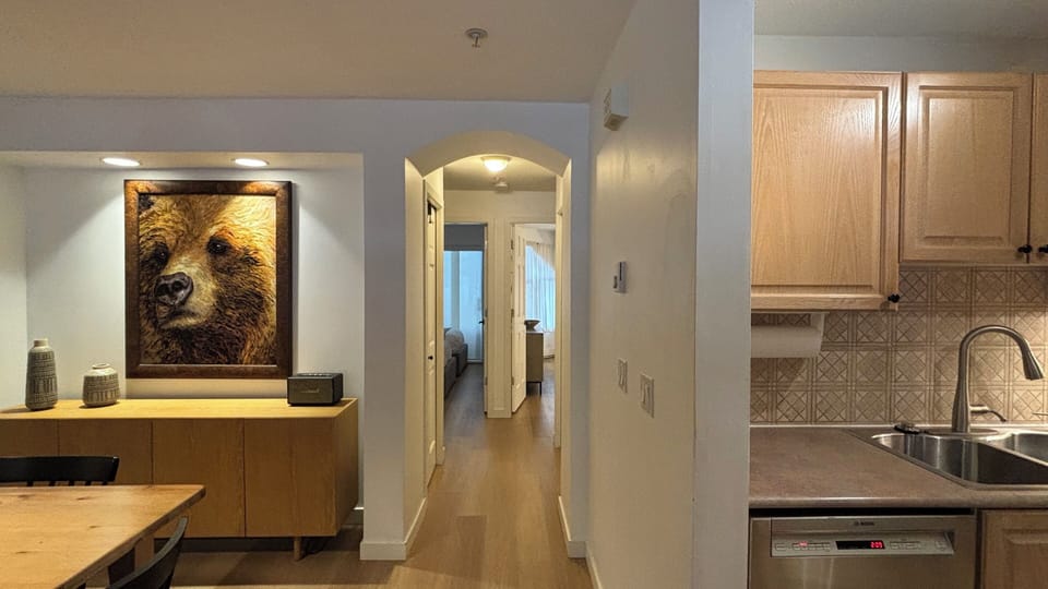 Dining room and kitchen view to the hallway.
