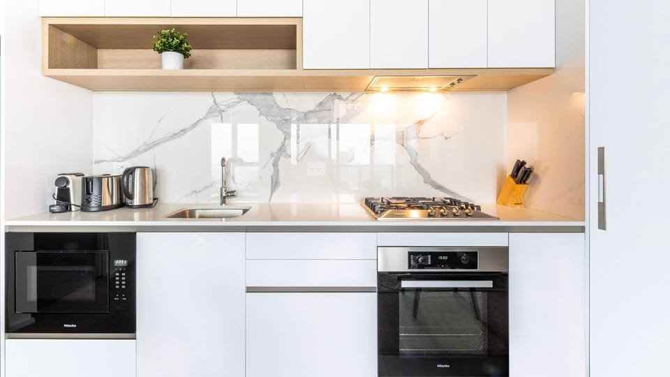 Sleek, fully equipped kitchen with quality appliances.