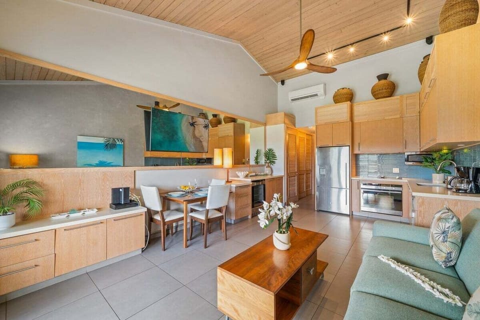A full view of the interior showing the high-end finishes, designer lighting, and integrated storage for a clutter-free stay.