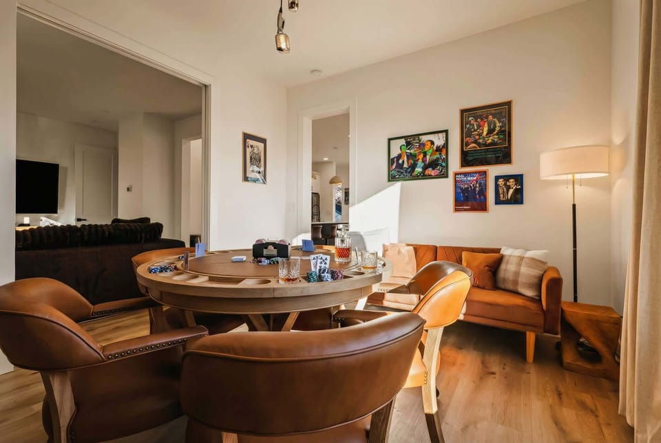 Open-plan game room keeps the cook in the loop while poker and conversation flow all night, nobody ever left out of the action