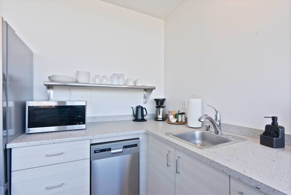 Enjoy cooking in this sleek, modern kitchen with all essentials provided