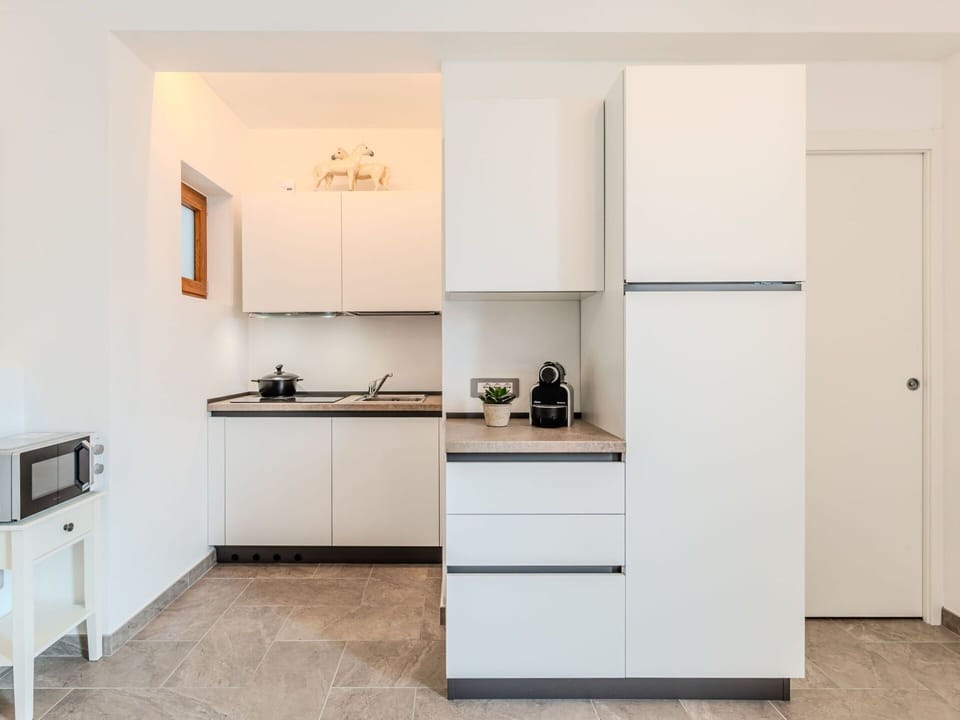 Kitchen, Kitchen Appliance, Countertop, Cabinetry, Interior Design, Furniture, Flooring, Wood, Major Appliance, Home Appliance