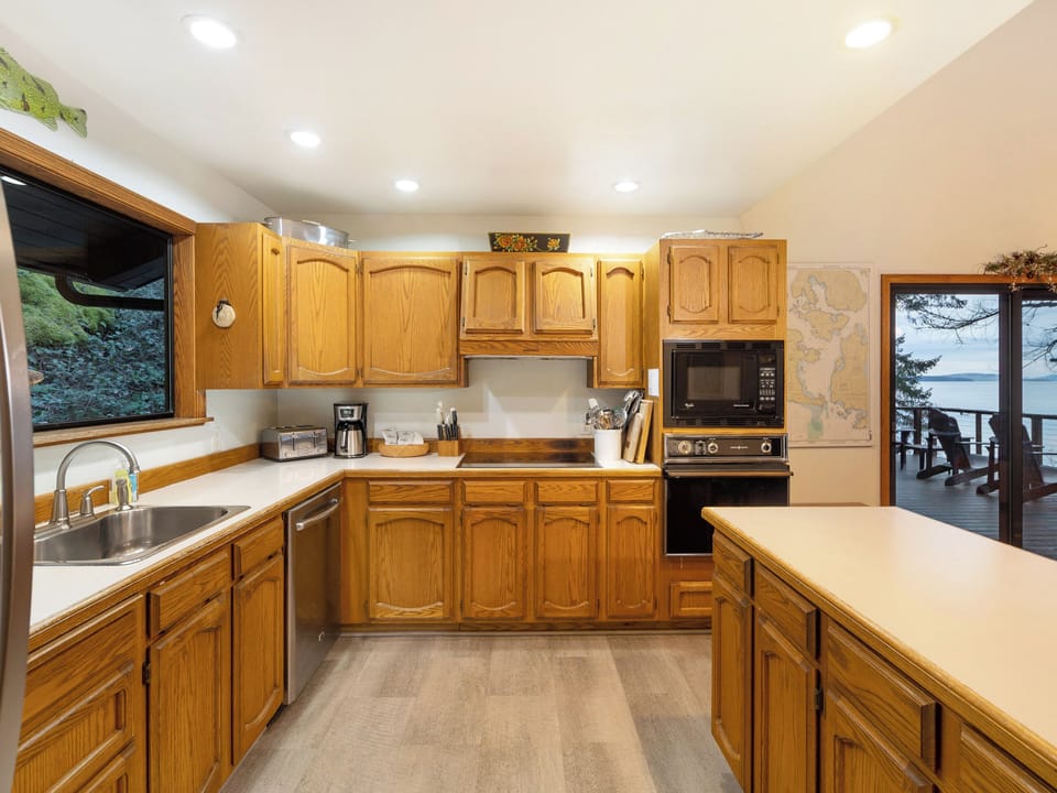 Full kitchen, open to the dining area and spacious deck.