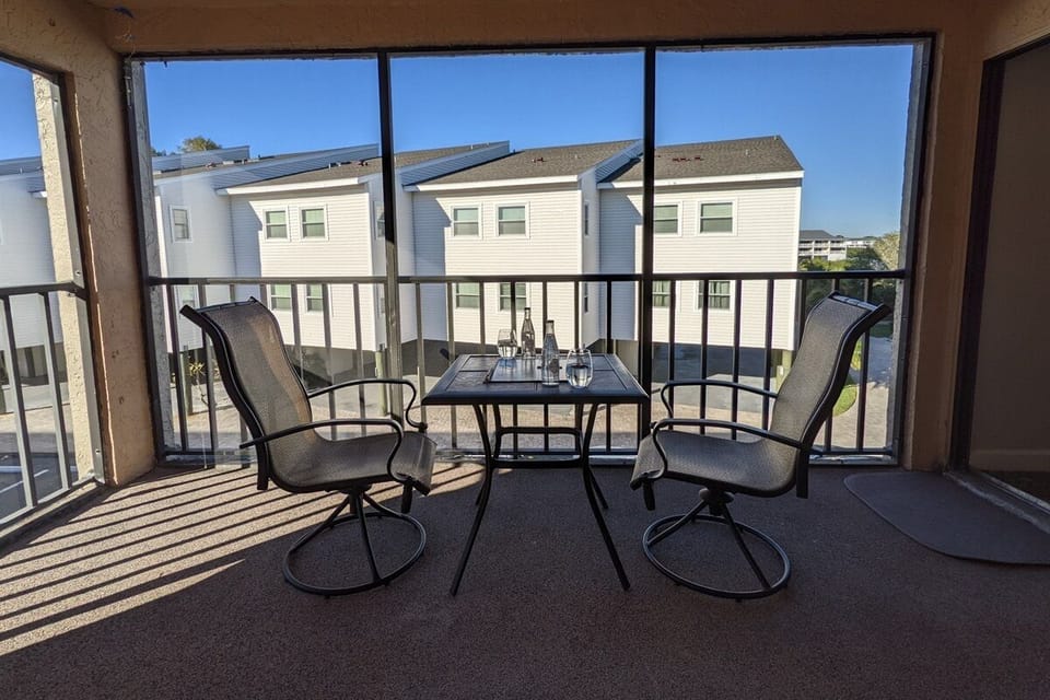 Relax on this screened-in balcony
