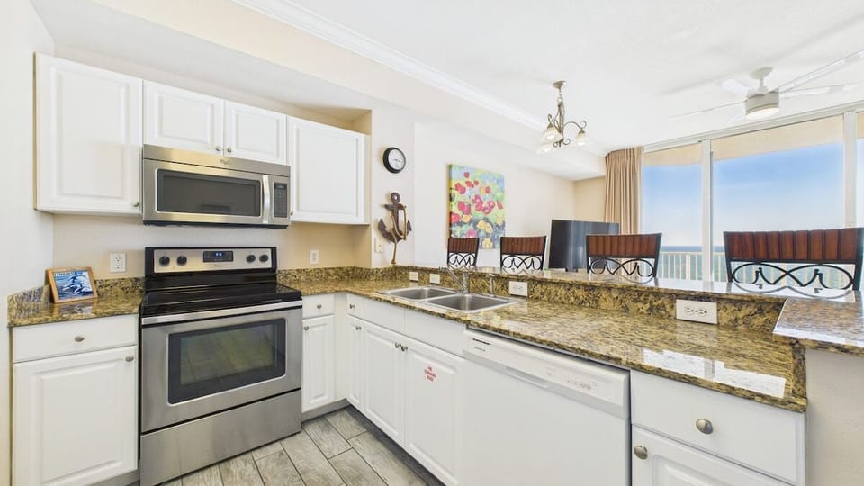 Full kitchen with stainless appliances and all the cooking essentials