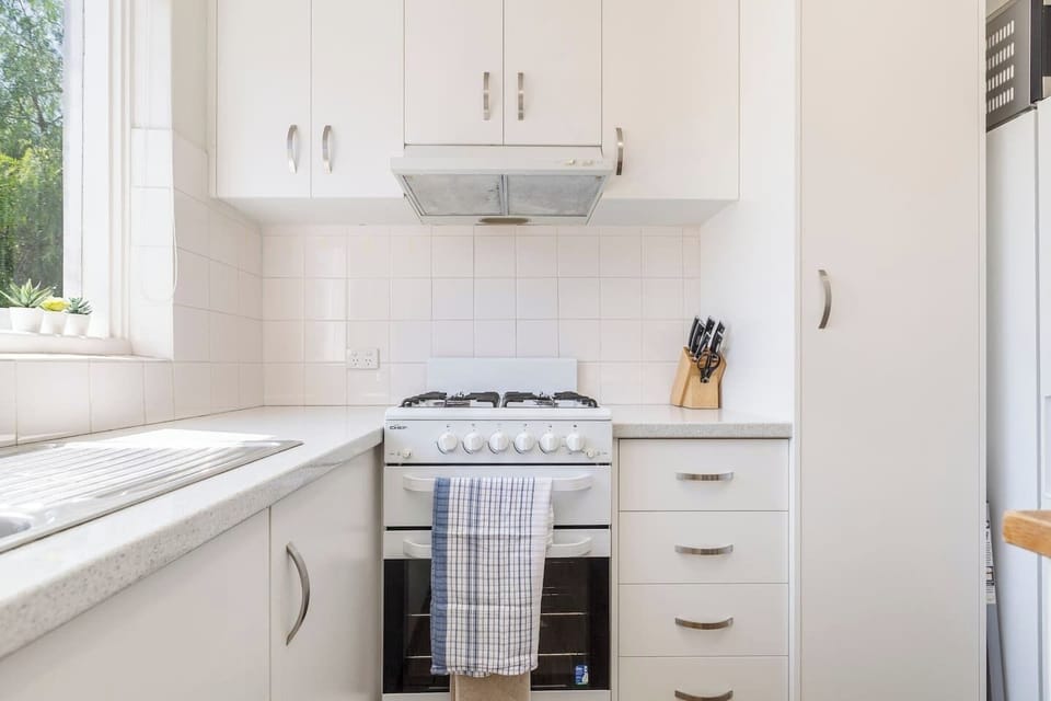 Prepare simple meals in the compact kitchen, equipped with a gas stove and oven.