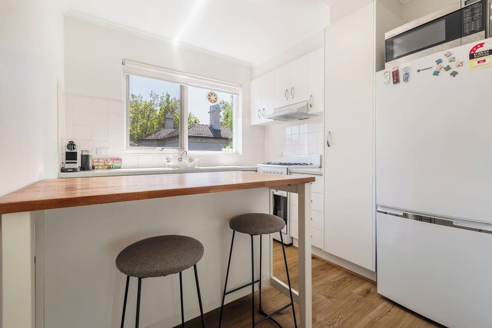 Start your day at the kitchen bench, where bar stools offer the perfect spot for a laid-back breakfast or a quick coffee break.