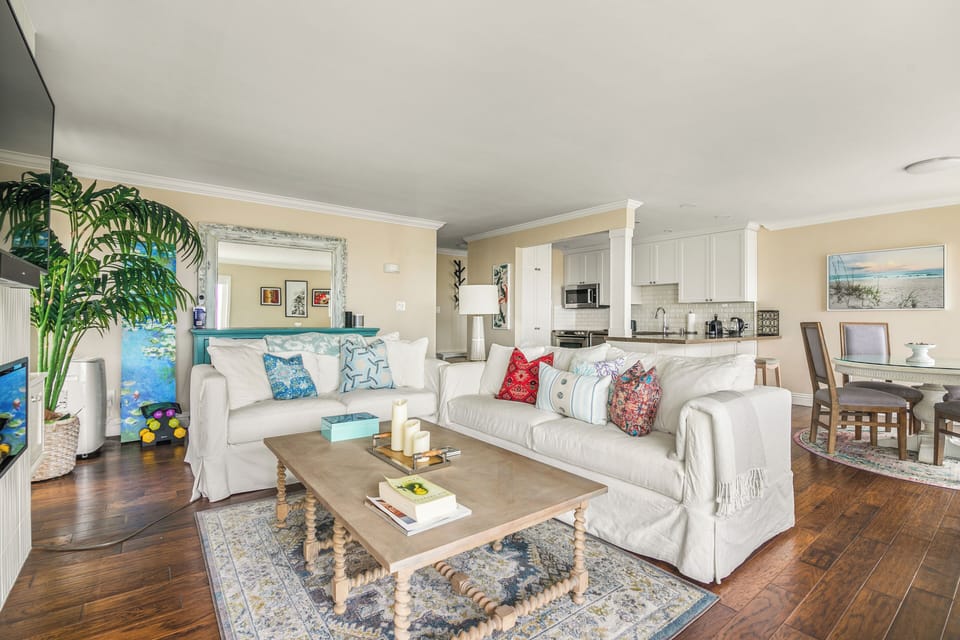 Open-concept layout seamlessly connects the dining and living areas for a spacious feel.