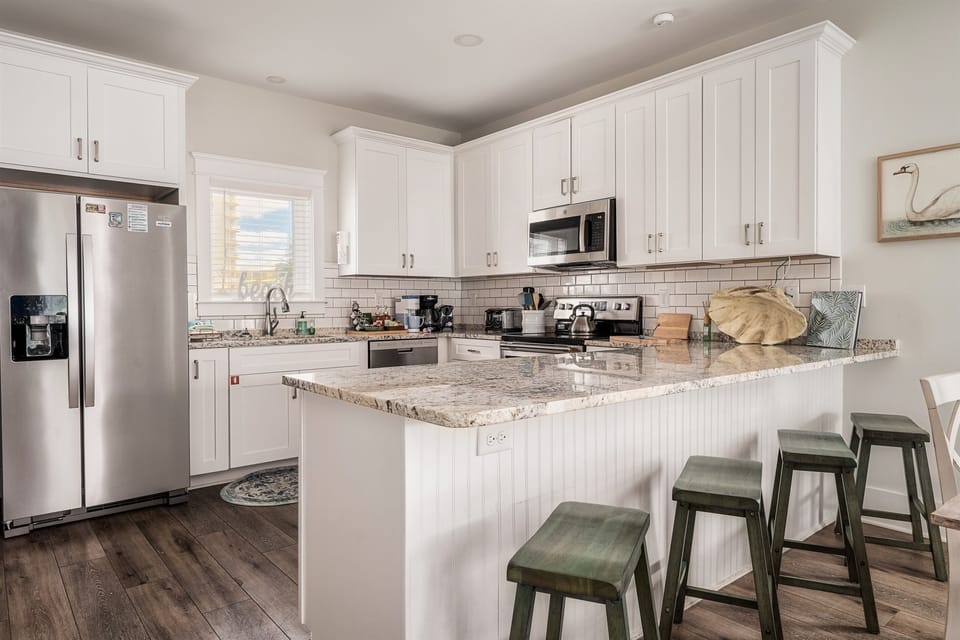 A well-appointed kitchen awaits, fully stocked with everything you need to whip up a delicious meal! "...the kitchen has everything you need and more..." -Patti L.