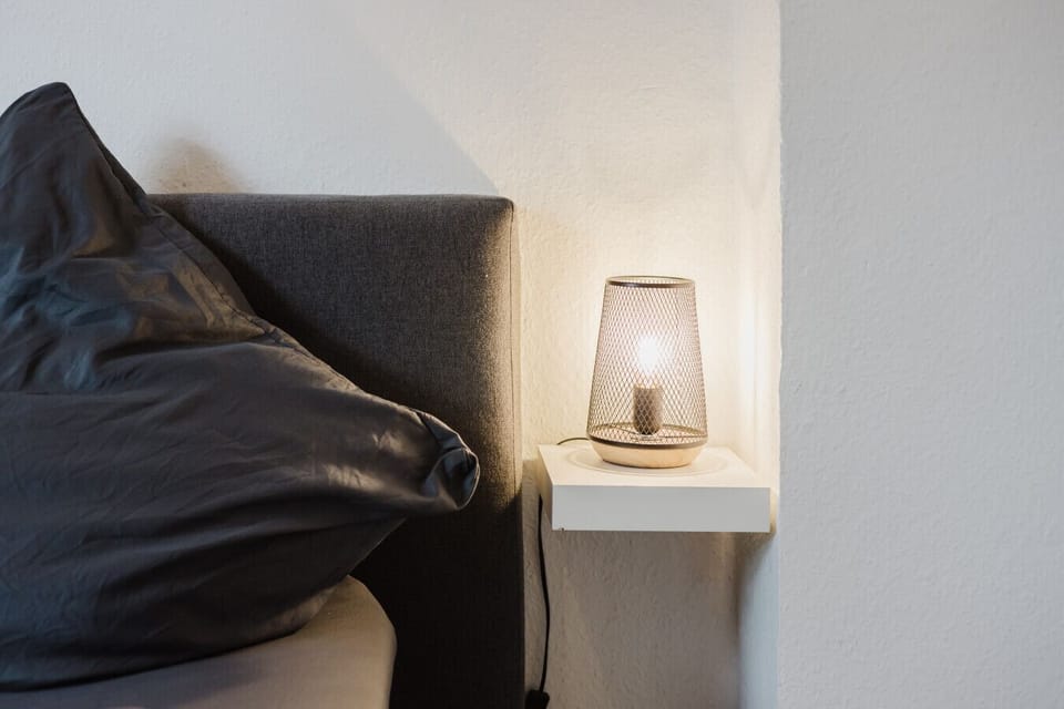 Soft lighting and cozy textures create a perfect sleep atmosphere.