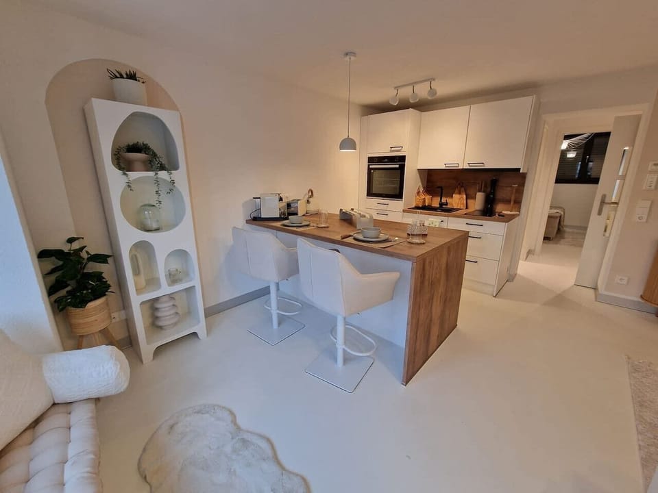 Open kitchen with integrated dining area.