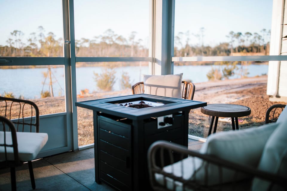 Enjoy the incredible view of our backyard pond from the screened porch!