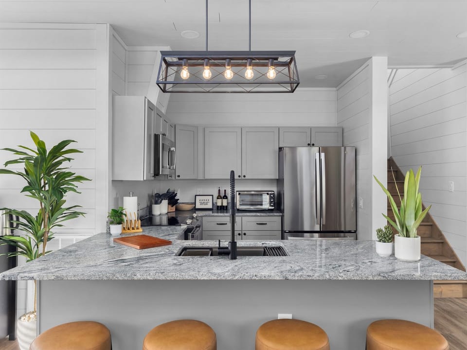 Stay part of the conversation while prepping meals at the island, perfectly connected to the dining and living spaces.