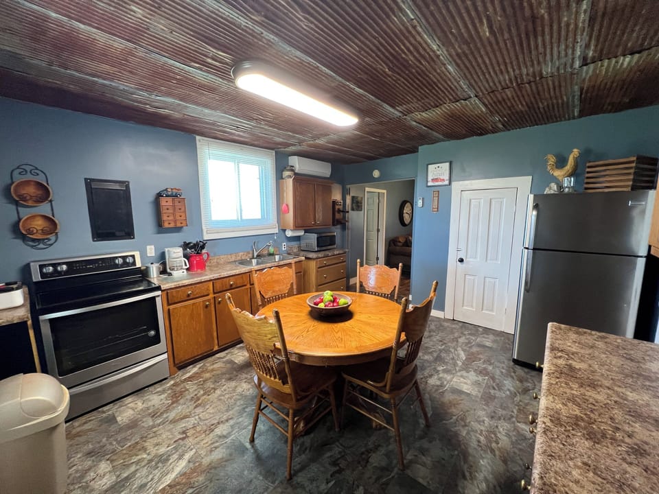 Full kitchen with entry directly onto rear porch.