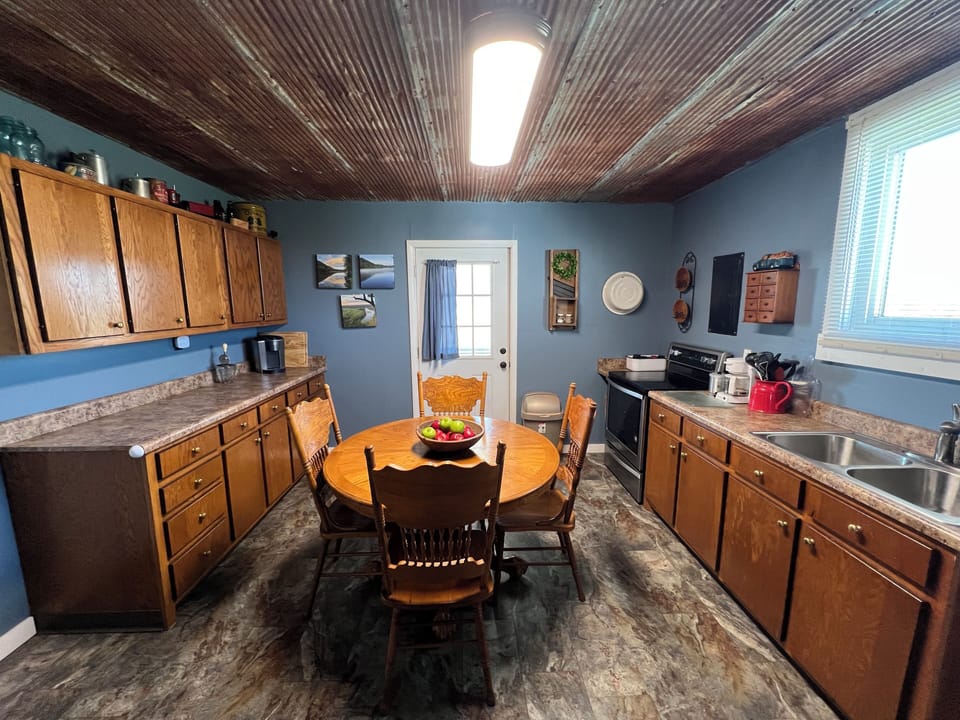 Full kitchen with entry directly onto rear porch.
