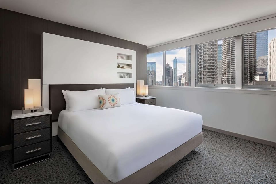 Wake up refreshed in crisp linens with skyline views.