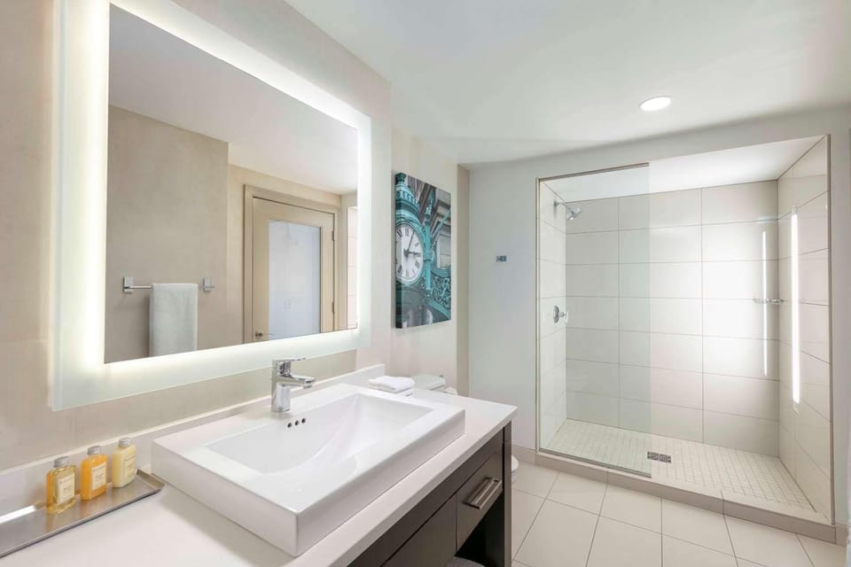 Refresh in a spa-bright bath with a sleek walk-in shower.