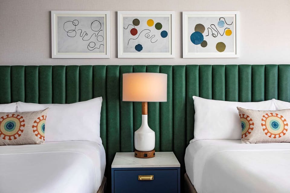 Drift off beneath statement headboards and cloud-soft pillows.