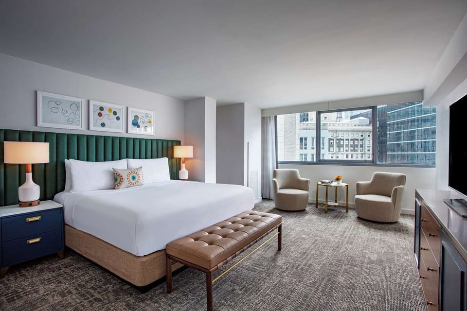 Unwind in a spacious king bedroom with sweeping city views.