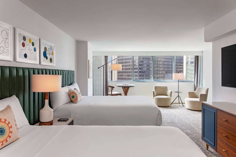 Stretch out in an airy room with inviting seating by windows.