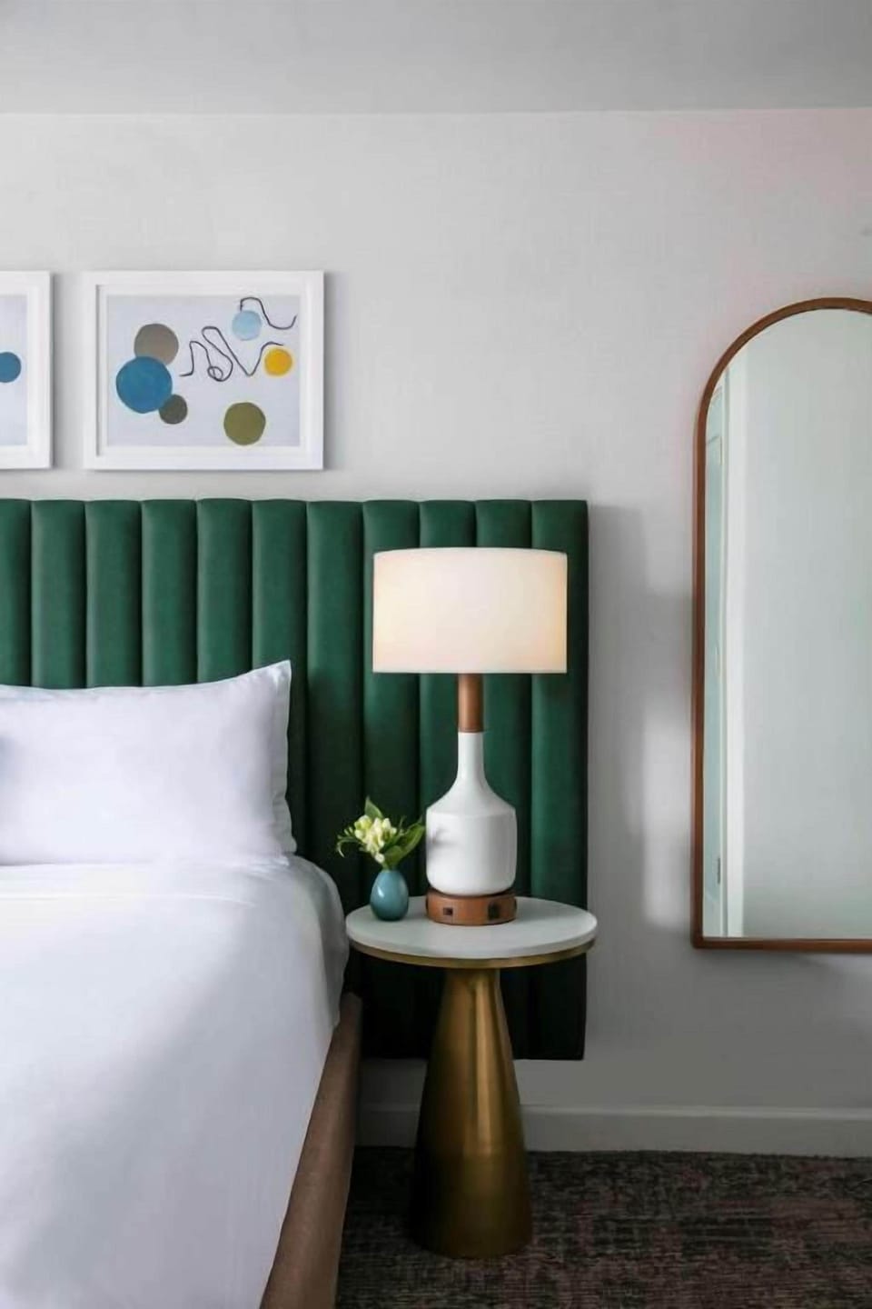 Unwind beside crisp linens and soothing designer bedside glow.