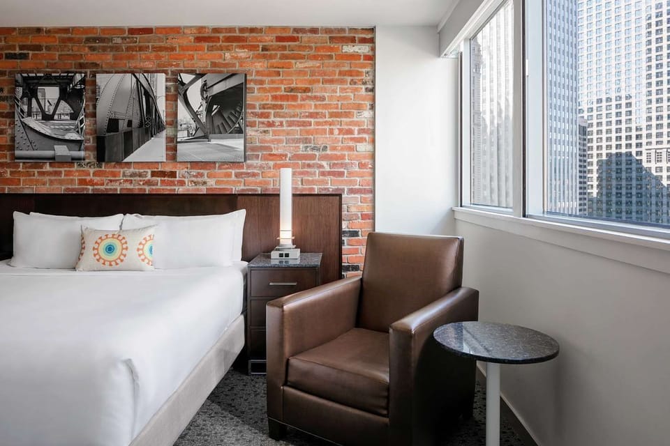 Settle by the window with a book in the comfy chair.