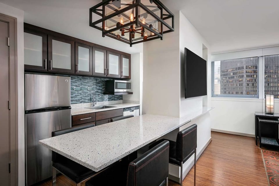 Cook with ease in a sleek kitchen with breakfast bar.