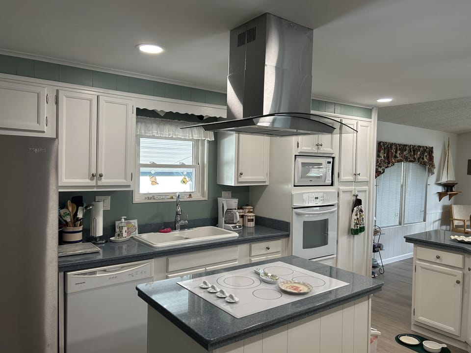Modern kitchen with sleek island and stainless steel appliances