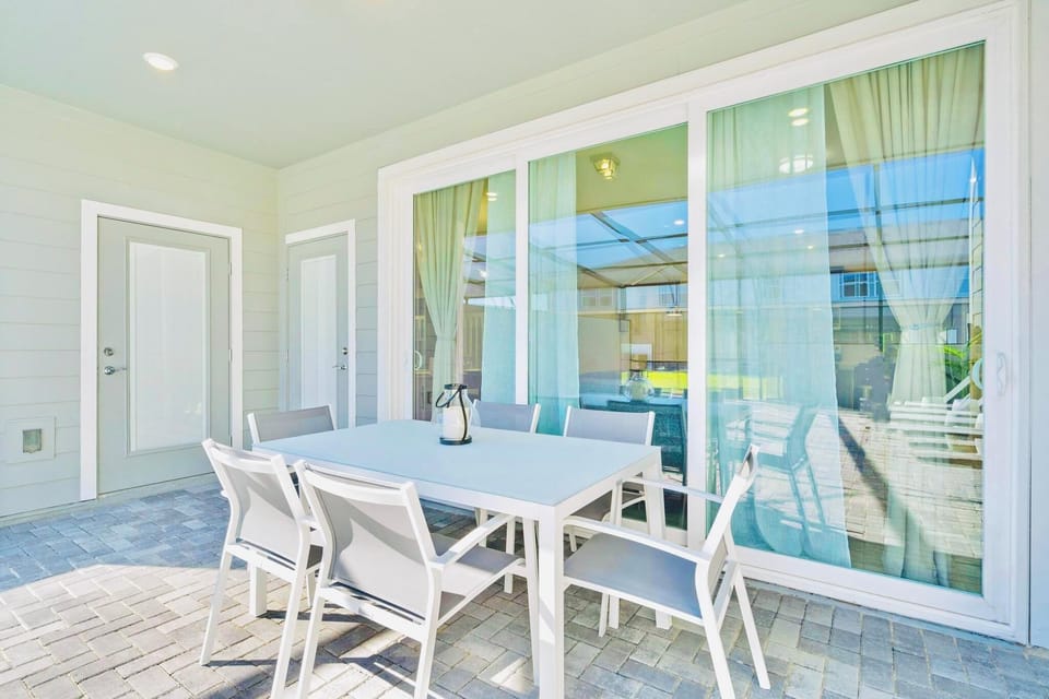 Covered Outdoor Dining Area Overlooking the Pool