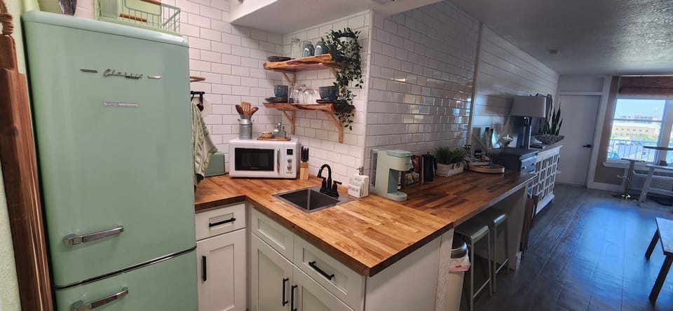 cozy kitchenette, Kpod coffee, artisinal tea service, air fryer, and microwave. 