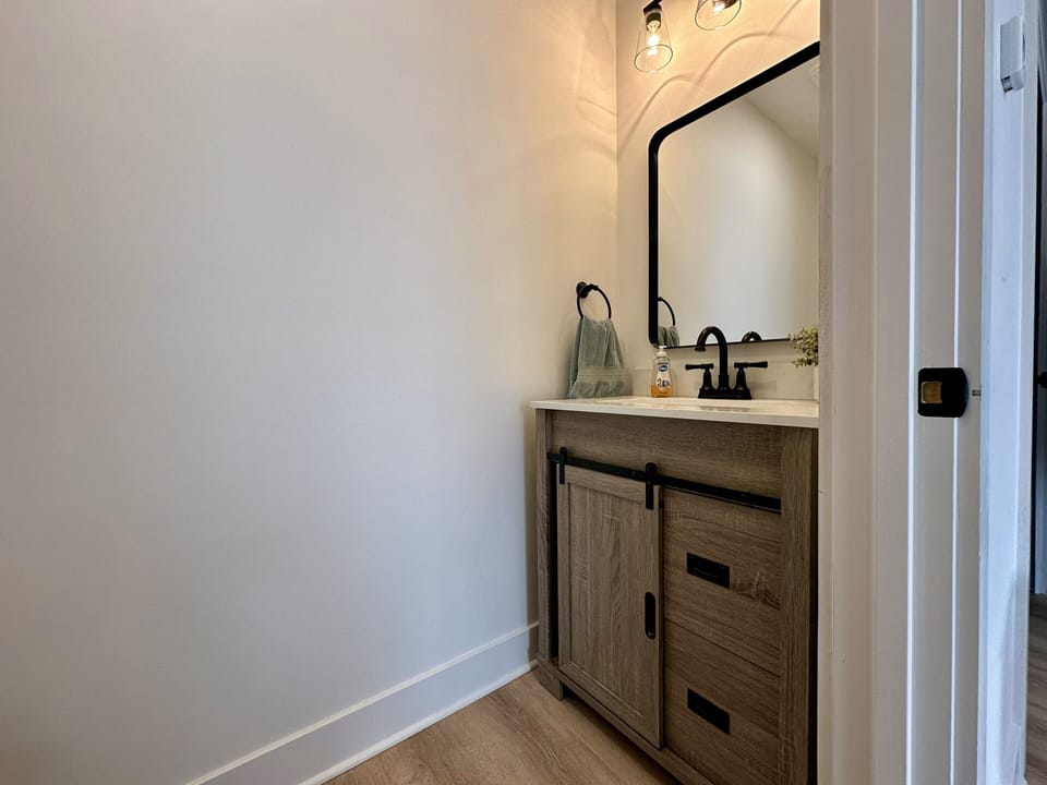 Vanity with storage in the first floor half bathroom. 
