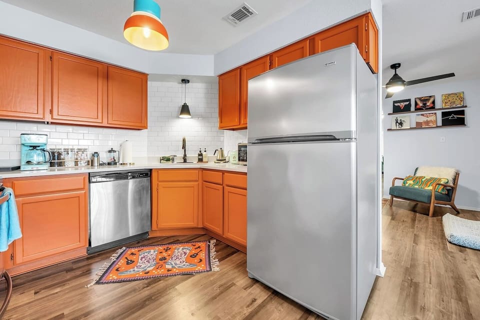 Fully equipped kitchen with a modern refrigerator, perfect for storing your fresh produce and leftovers during your stay.