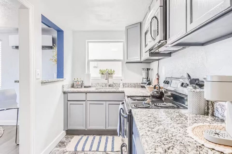 Whipping up magic in our charming little kitchen with white cabinets! ✨🧁 Every meal feels like a delightful masterpiece here.