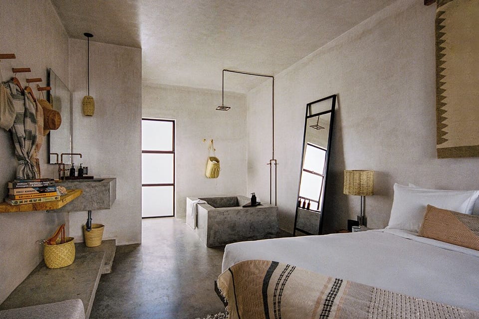Recharge in serene concrete chic with soft, natural textures.