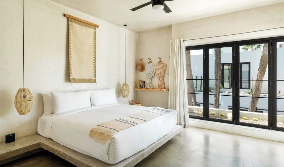 Relax in bright, airy comfort with garden views outside.