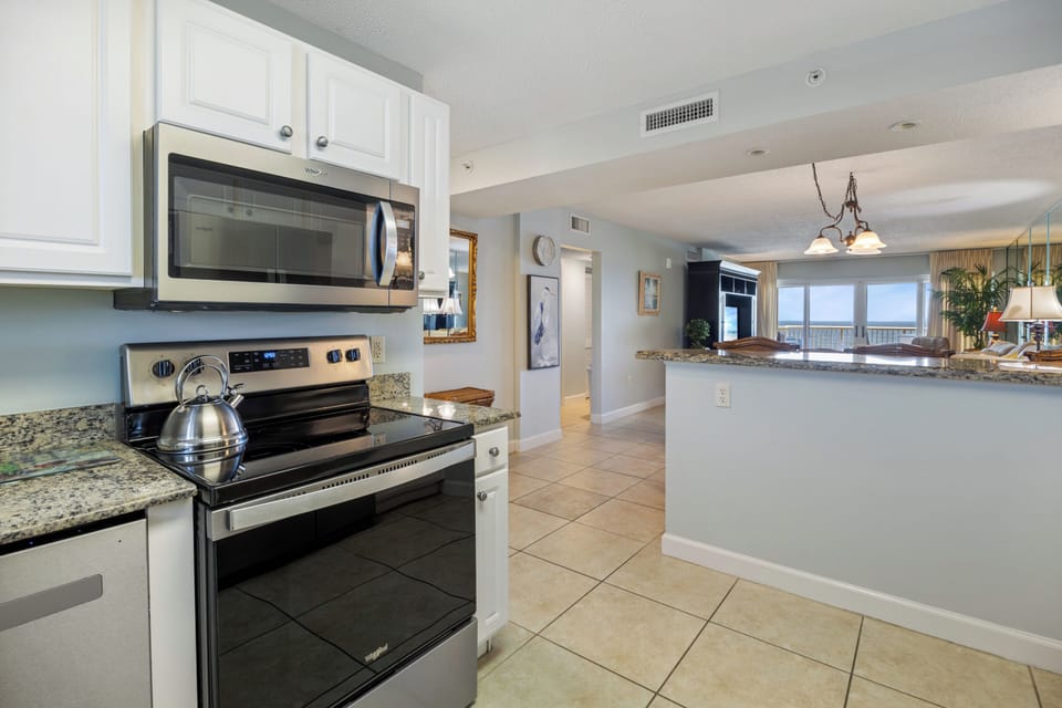 Sunrise At Sandy Key Unit 613 by PKRM - Granir counter tops and stainless appliances are always nice touches!