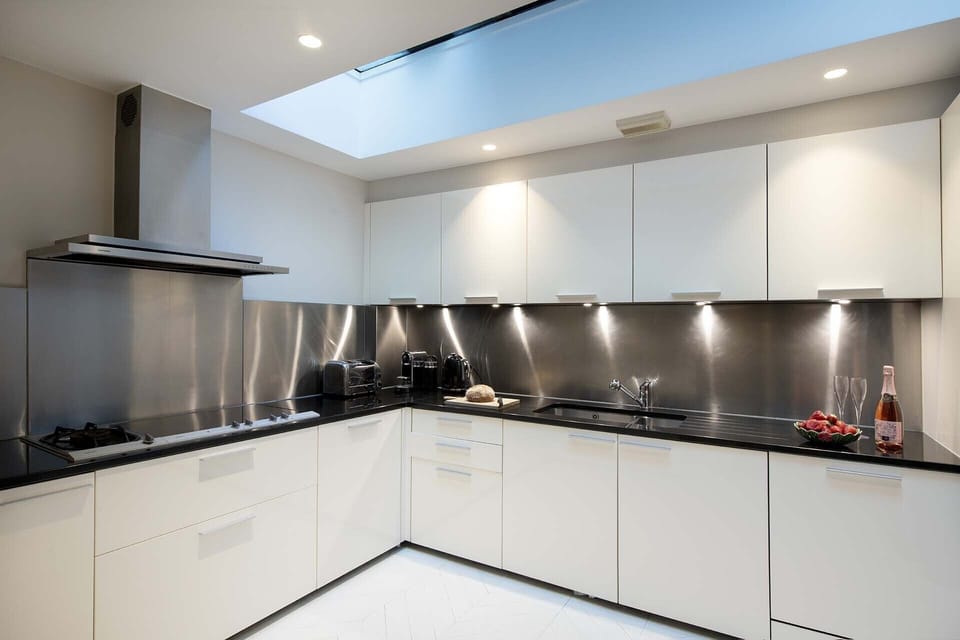 Sleek modern kitchen is fully equipped.