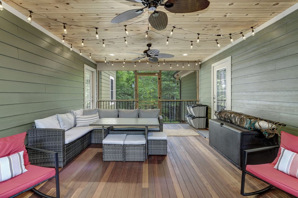 Outdoor seating and eating area on screened-in porch