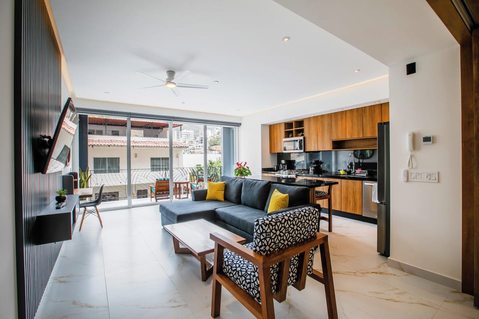 Living room – thoughtfully decorated with artwork, featuring comfortable seating and a dedicated workspace