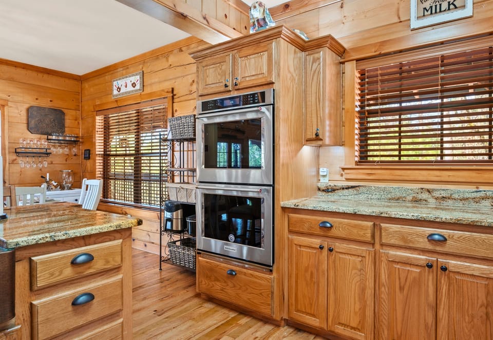 Double ovens, custom cabinetry, and a well-organized layout make this kitchen ideal for cooking and entertaining.