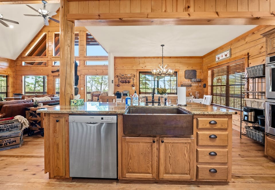 This open-concept kitchen and dining area blends rustic charm with modern convenience, making cooking a joy.