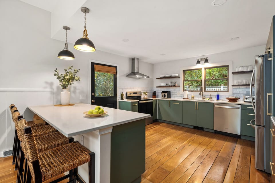 Kitchen Haven: Bright space with modern appliances and inviting bar seating for culinary adventures!