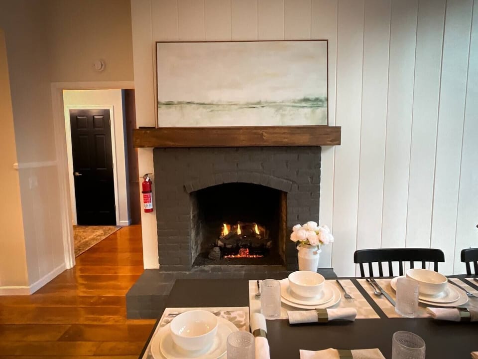 Such a cozy setting for a special meal with family or friends, the dining room features a zink table with seating for up to 10 nestled.
