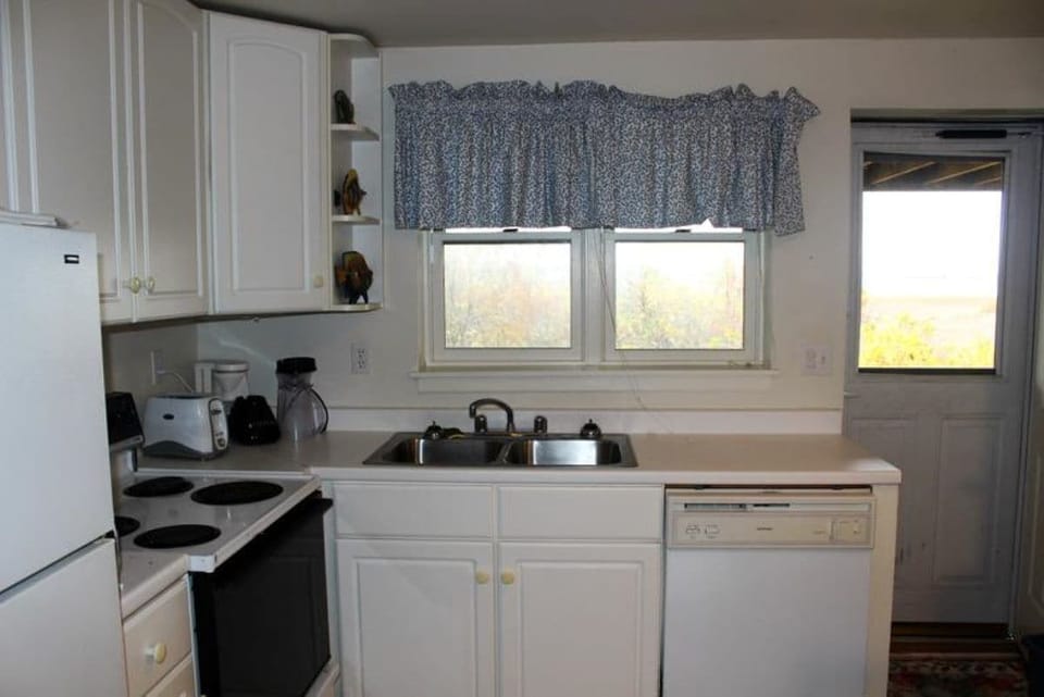  "Downstairs kitchen with a stunning marsh view—cook with a view!
