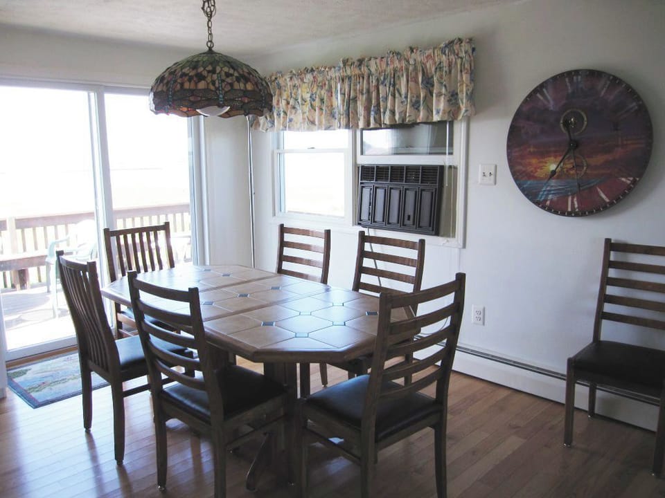"Spacious dining area flows from kitchen to deck—dine with a view! 