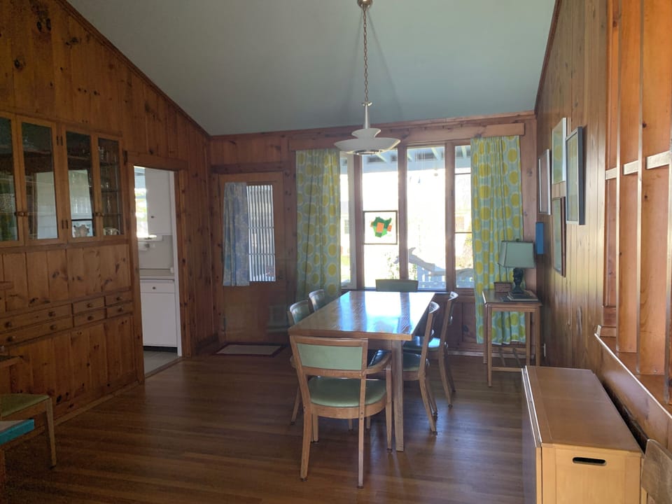 Dining room includes one table for eight plus a second folding table for six.