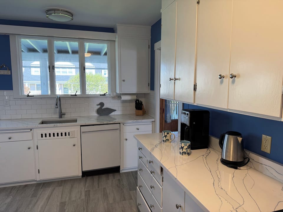 Kitchen looks out over the street side porch.